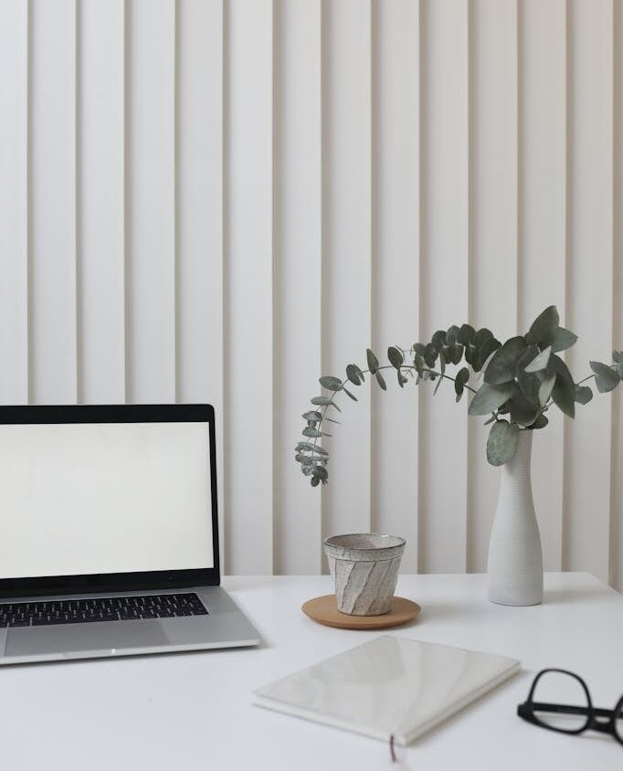 Light workplace with laptop in office