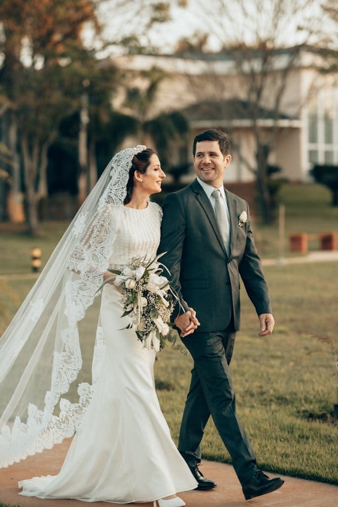 Happy Bride and Groom Walking Outdoors