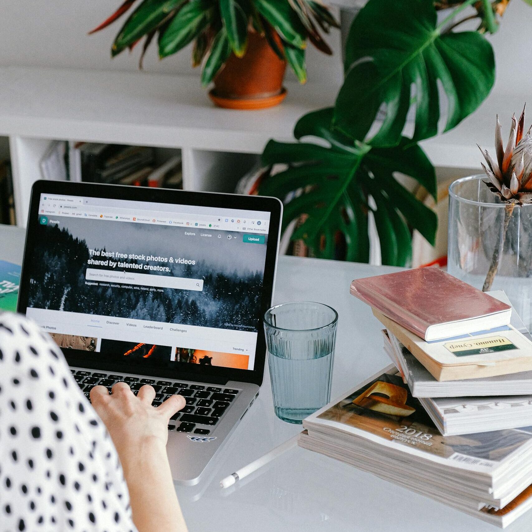 Person Using Macbook Pro on Table